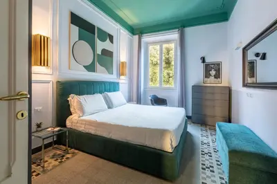 a bedroom with a bed and a window at ROMAC Mazzini with 5 bedrooms near the Vatican in Rome