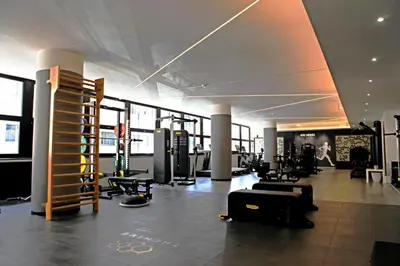 a gym with treadmills and equipment in a building at The Hive Hotel in Rome