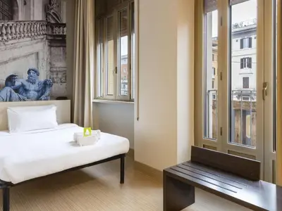a bedroom with a bed and a window at B&B Hotel Roma Trastevere in Rome