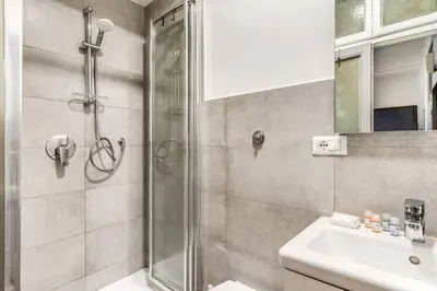 a bathroom with a shower and a sink at Lovely renovated flat by Vatican in Rome