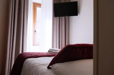 a hotel room with a bed with a window at Affittacamere Boncompagni Suite in Rome