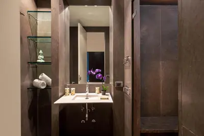 a bathroom with a sink and a mirror at SK ROME Apartment Luxury Torre Argentina in Rome