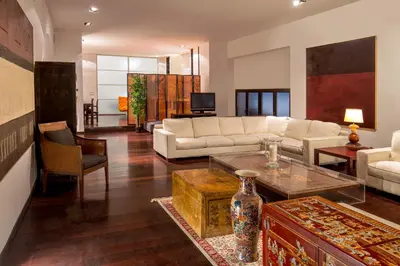a living room with a couch and a table at SK ROME Apartment Luxury Torre Argentina in Rome