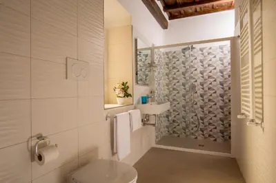 a bathroom with a toilet and a shower at SK ROME - Apartment Luxury Navona in Rome