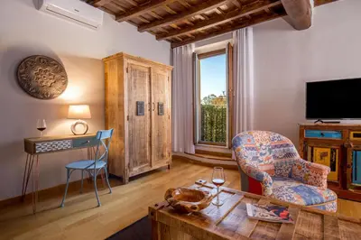 a living room with a couch chair and a table at SK ROME - Apartment Luxury Navona in Rome
