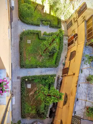 an overhead view of a garden on the side of a building at A casa di Alex Vatican in Rome