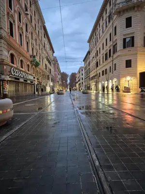 an empty street in a city at night at A casa di Alex Vatican in Rome