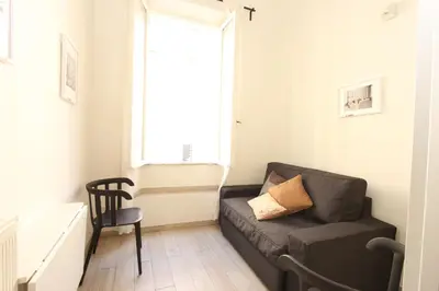 a living room with a couch and a window at Penna Flats in Rome