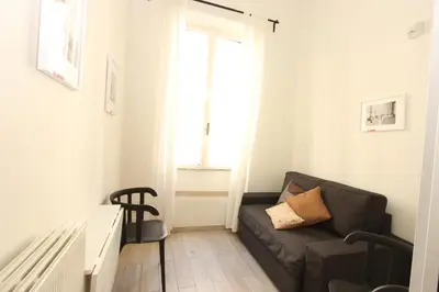 a living room with a couch and a window at Penna Flats in Rome