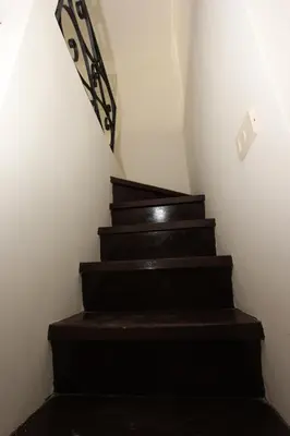 a set of stairs in a room with a railing at Penna Flats in Rome