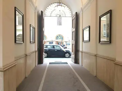a hallway with a car parked in a parking lot at Hotel Positano in Rome