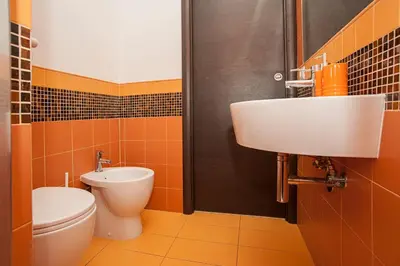 a bathroom with a toilet and a sink at Flowerome in Rome