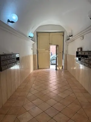 a room with a hallway with a tile floor at Trani B&T Rooms in Rome