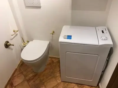 a white toilet in a small bathroom at La Casa Dei Marmi in Rome
