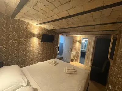 a bedroom with a bed with towels on it at Giolitti Suite in Rome