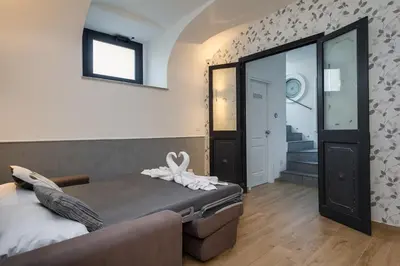a bedroom with a bed and a sliding glass door at Giolitti Suite in Rome