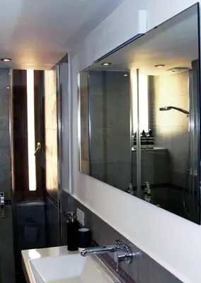 a bathroom with a sink and a large mirror at MANDRUCHELLO'S in Rome
