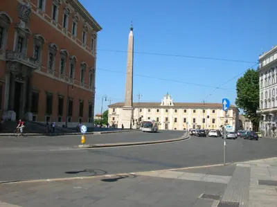 a street with a tall tower in the middle of a building at Emanuela Guest House in Rome