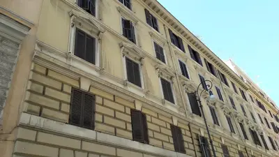 a large building with many windows on the side of it at Emanuela Guest House in Rome