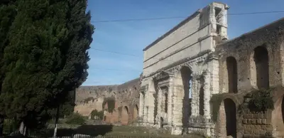 an old stone church with a tree next to it at Emanuela Guest House in Rome