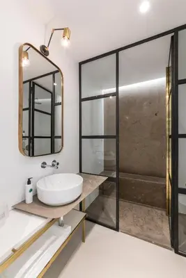 a bathroom with a sink and a shower at Horti 14 Borgo Trastevere Hotel in Rome