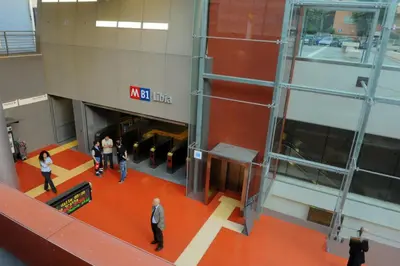 a group of people walking around in a building at CoPPoLaMyHouse in Rome