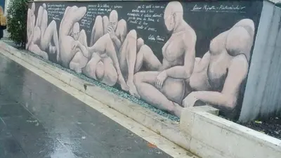 a mural of naked men on a wall at CoPPoLaMyHouse in Rome