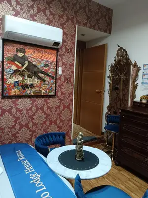 a room with a table and a painting on the wall at CoPPoLaMyHouse in Rome