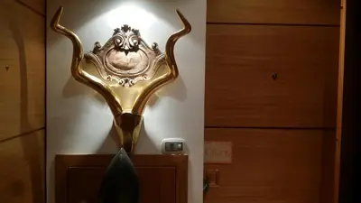a gold trophy on a wall in a room at CoPPoLaMyHouse in Rome