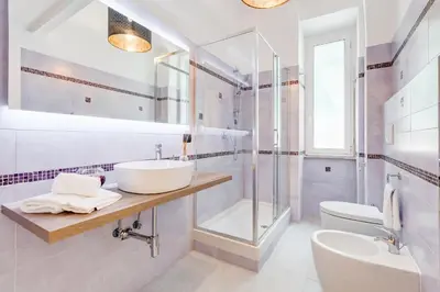 a bathroom with a sink and a shower and a toilet at Vaticano Private Apartment in Rome