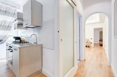 a kitchen with a sink and a stove at Vaticano Private Apartment in Rome