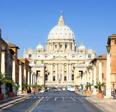 a large white building with a domed building at Vaticano Private Apartment in Rome