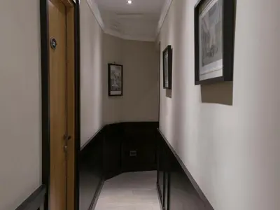 a hallway with a stairway with a stair case at DK Suites in Rome