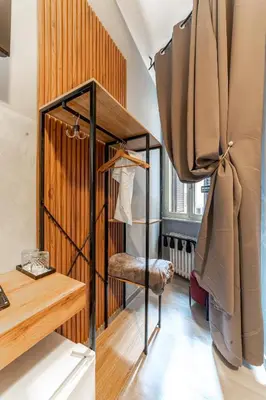 a small room with a bed and a desk at Domus Domas & Boutique - Golden Keys Collection in Rome