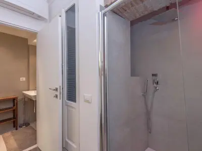 a shower with a glass door in a bathroom at Apartment Forum Augusti by Interhome in Rome