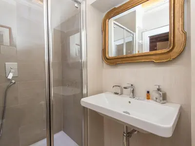 a bathroom with a sink and a shower at Apartment Forum Augusti by Interhome in Rome