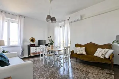 a living room with a couch and a table at BigFamilyRome - San Giovanni Basilica in Rome