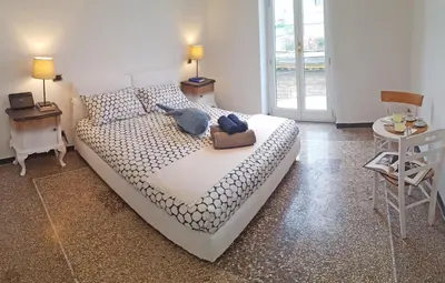 a bedroom with a bed and a table and chairs at BigFamilyRome - San Giovanni Basilica in Rome