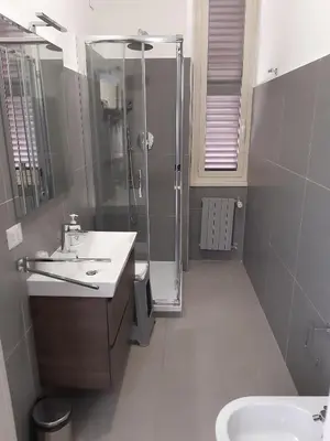 a bathroom with a shower and a sink at Ostello Villa Monte Mario in Rome