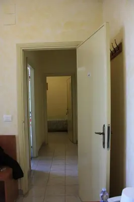 a hallway with an open door to a room at Ostello Villa Monte Mario in Rome