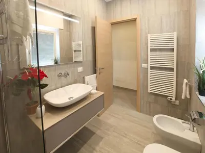 a bathroom with a sink and a mirror at Appartamento Turistico Laura in Rome