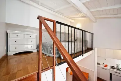 a room with a staircase leading to a bedroom at Romacentrarte in Rome