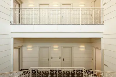 a balcony of a house with a staircase at The First Arte - Preferred Hotels & Resorts in Rome