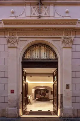 an entrance to a building with a statue of a cow at The First Arte - Preferred Hotels & Resorts in Rome
