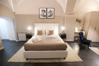 a bedroom with a large bed with two towels on it at Suite 21 - Piazza Navona in Rome