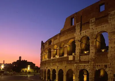 a building with arches in front of it at night at Suite 21 - Piazza Navona in Rome