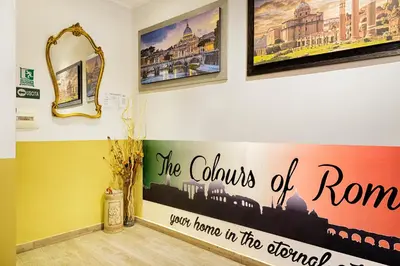 a room with paintings on the wall at The Colours Of Rome in Rome