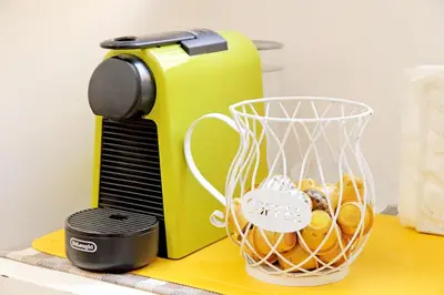 a mixer on a counter with a basket of donuts at Opera Inn Suites - Rooms and Apartments in Rome
