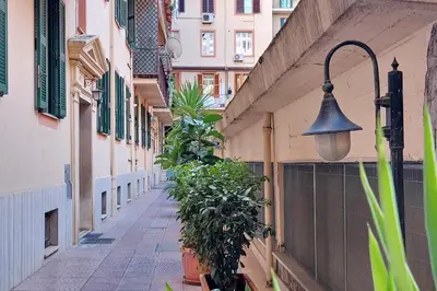 an alley with a bell on the side of a building at Opera Inn Suites - Rooms and Apartments in Rome