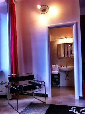 a room with a chair and a sink and a mirror at Vatican Paradise in Rome